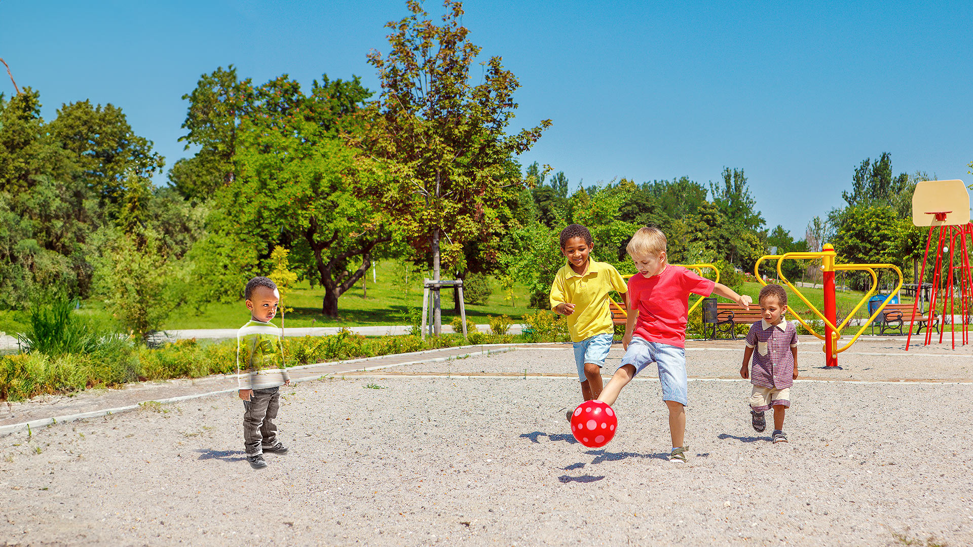 Photo of kids playing with a ball in a park