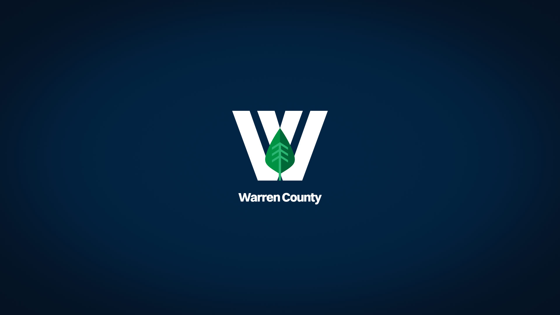 White Warren County logo over navy blue gradient background